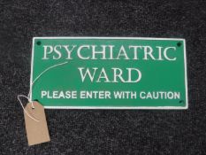 A cast metal plaque "Psychiatric Ward"