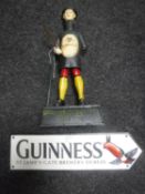 A cast metal Guinness money box with sign (2)