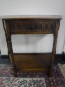 A shaped Jaycee Oak hall table fitted a drawer