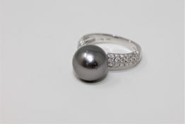 A 14ct white gold silver pearl ring,