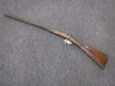 A 19th century percussion cap double-barrelled shotgun