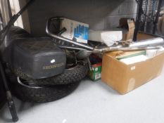 A large quantity of motorcycle parts including Honda seat, wheels, exhaust pipe,
