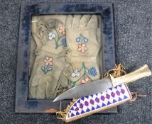 A pair of 'Frontier' style gloves with beadwork decoration, in blue velvet frame,