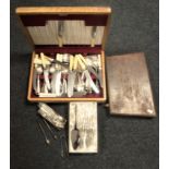 Two oak canteens of cutlery and a box of sugar tongs,