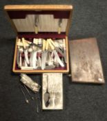 Two oak canteens of cutlery and a box of sugar tongs,