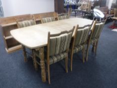 A blonde oak extending table plus one leaf and six dining chairs