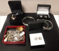 A collection of silver and white metal jewellery including cufflinks, chains, pendant, bangles etc.