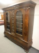 An early 20th century continental oak triple door dresser, fitted with two drawers,