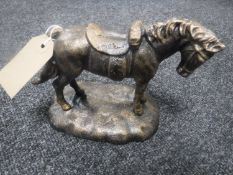 A cast metal figure of a horse