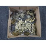 A box of horse brasses (some on leather straps)