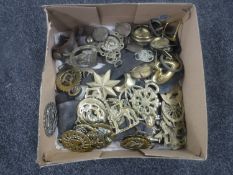 A box of horse brasses (some on leather straps)