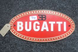 A cast metal plaque "Bugatti"