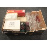 A box of boxed and unboxed glass ware