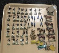 A tray containing a collection of vintage hand-painted lead military figures including bandsmen,
