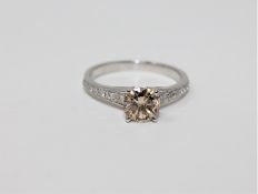 A 14ct white gold diamond solitaire ring featuring one round brilliant cut diamond 1.