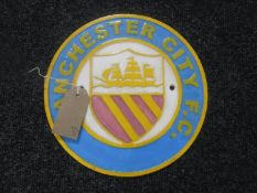 A cast metal plaque "Manchester City"
