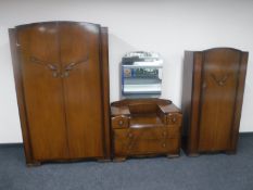 A three-piece walnut Art Deco bedroom suite comprising of lady's and gent's wardrobes and dressing