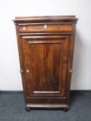 A 19th century continental mahogany sentry door cabinet fitted a drawer