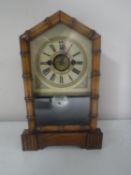 A pine cased American eight day mantel clock