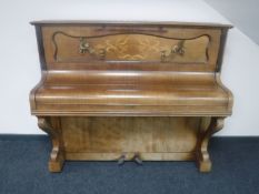 An inlaid walnut cased French overstrung piano,