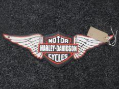 A cast metal plaque "Harley Davison"