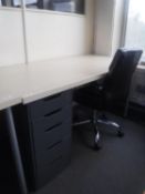 An Ikea desk with five drawer pedestal and swivel leather armchair