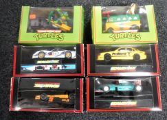 Four boxed Scalextric vehicles and two others