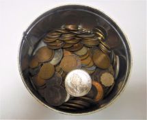 A tin containing pre-decimal copper coins, pennies and half pennies,