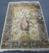 An Indian rug decorated with peacocks,