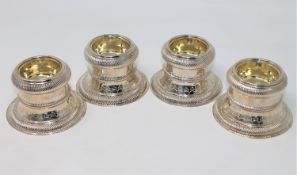 A superb set of four large Georgian silver gilt salts, London marks, Thomas Ross 1820,
