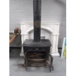A cast iron log burner with flue