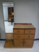 A mid 20th century mahogany linen chest fitted with a vanity mirror