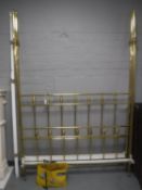 A brass 4'6 four poster bed frame (no side rails)