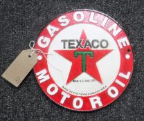 A cast metal plaque "Texaco"