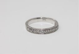 A heavy 18ct gold diamond half-eternity ring, approximately 0.