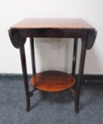 A mahogany two tier flap sided occasional table and an early 20th century pine child's armchair