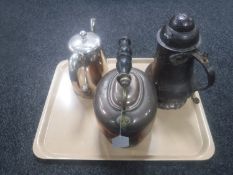 An antique copper lidded flaggon together with a copper kettle and silver plated water jug.