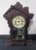 An American eight day striking mantel clock signed The Waterbury Clock Company