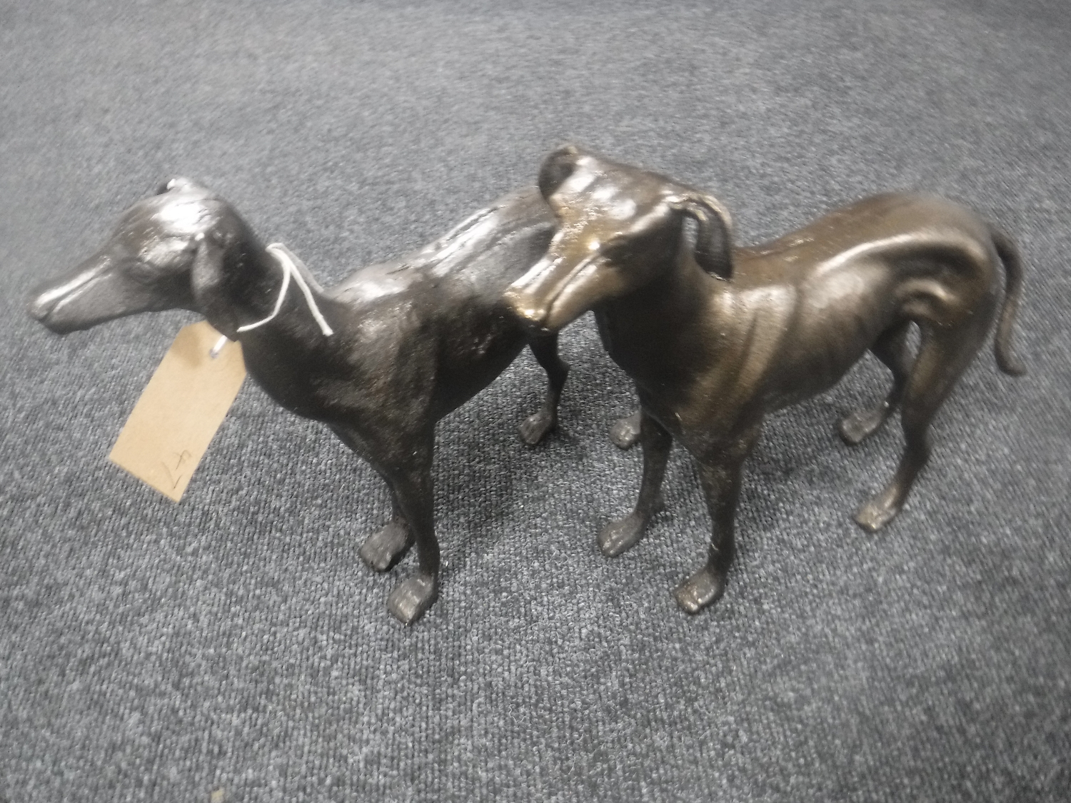 A pair of cast metal greyhound figures