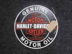 A cast metal plaque "Harley Davison Oil"