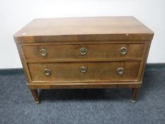 A 19th century continental mahogany two drawer chest with brass drop handles