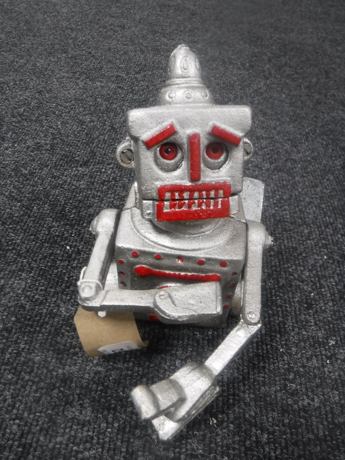 A cast metal robot money box