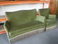 An early 20th century shaped settee and armchair upholstered in a green dralon