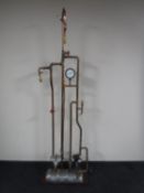 An industrial brass and copper floor lamp with various gauges