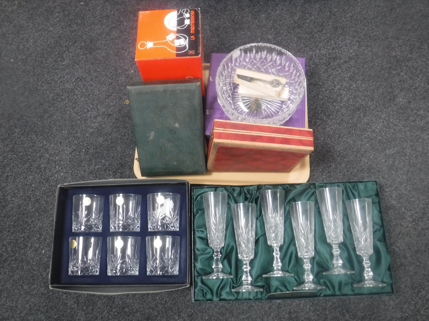 A set of six boxed crystal Royal County champagne flutes, six boxed Italian Crystal whisky tumblers,