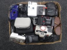 A box of assorted automatic cameras