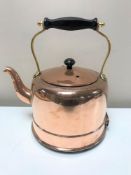A vintage copper and brass electric kettle