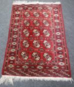 An Afghan bokhara rug,