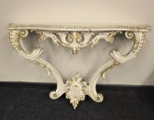 A cream and gilt Rococo style hall table