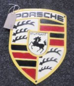 A cast metal plaque "Porsche"